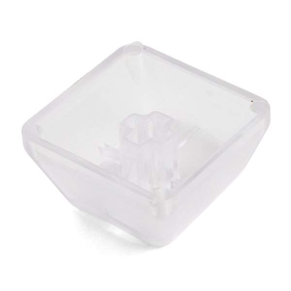 Một keycap nhựa trong suốt chụp cận cảnh trên nền trắng